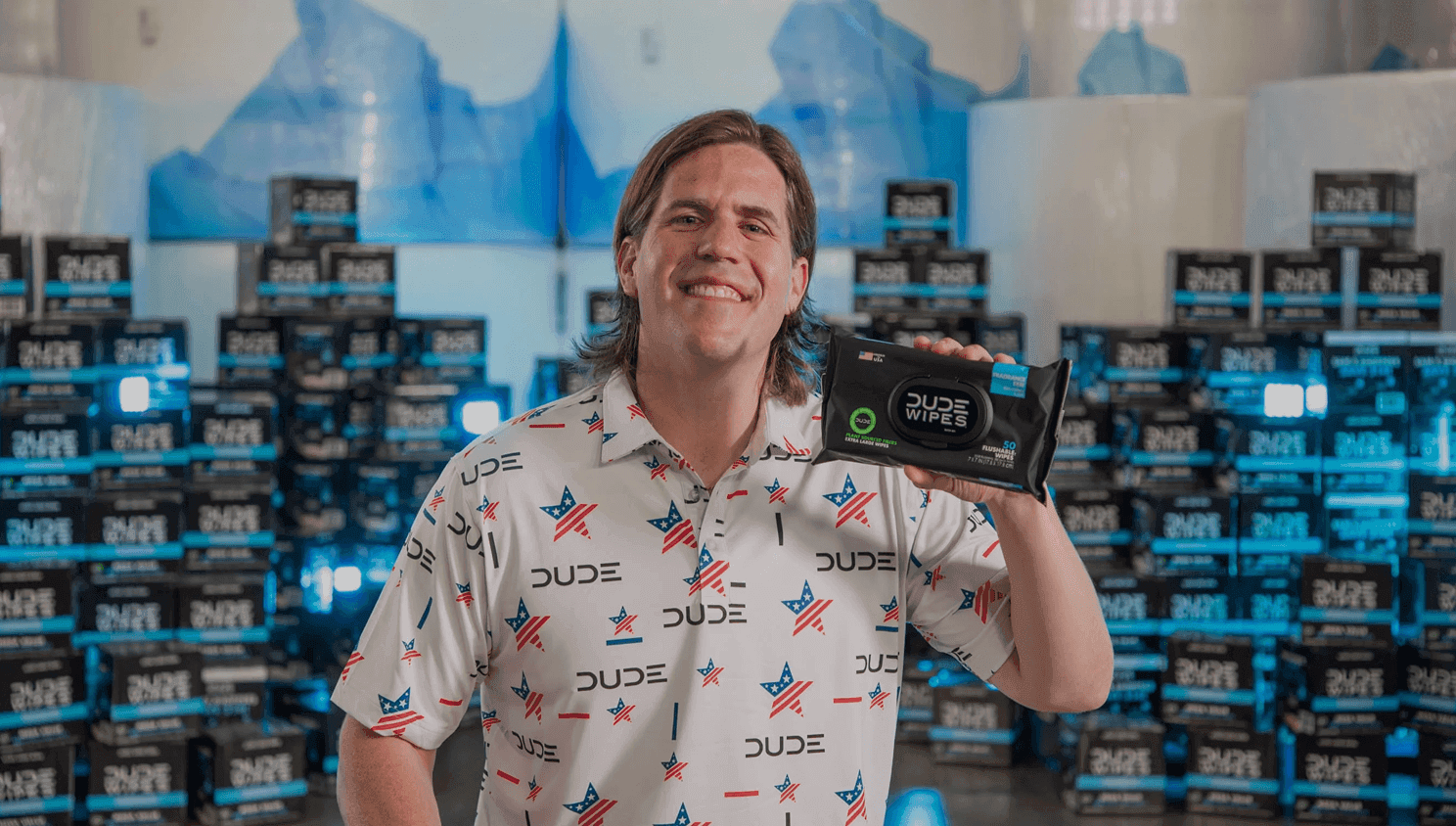 Person holding packaged wipes in a warehouse